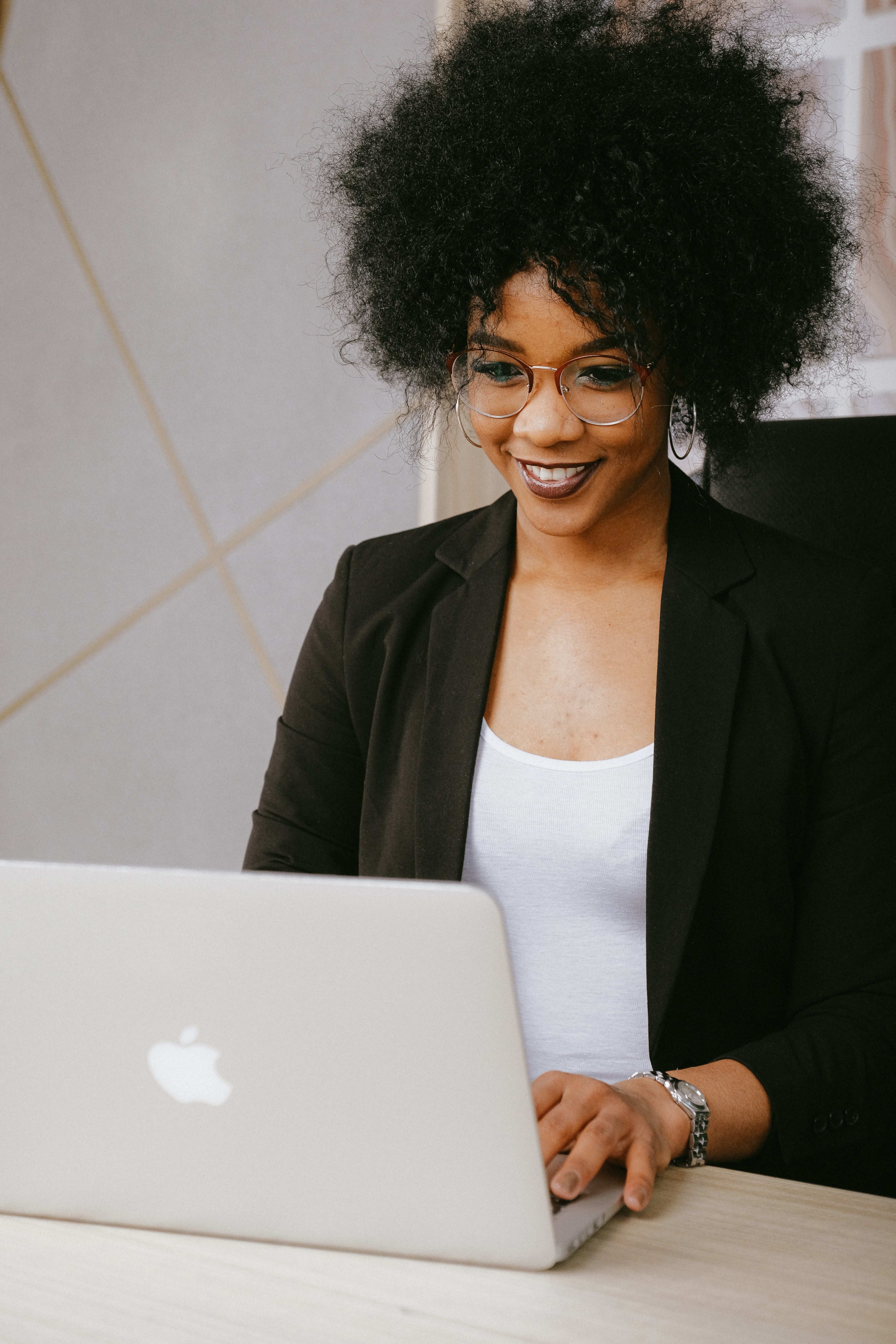 African-American woman working on a laptop